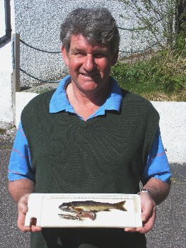 Mark Williams with the Brown trout and partly digested minnow from Sguod