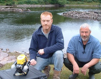 Aaron Forsythe and John Sangster with ROV by the River Ewe at start of salmon filming in August 2008